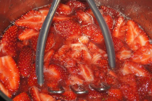 Use a vegetable masher to give the strawberries a head start.
